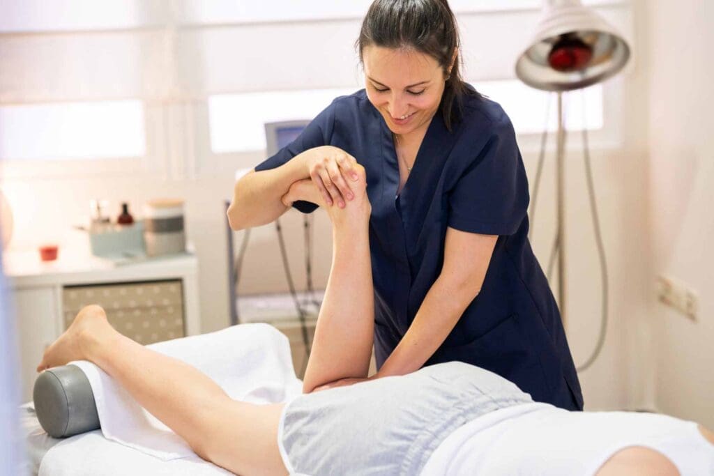 A massage therapist working on a patient