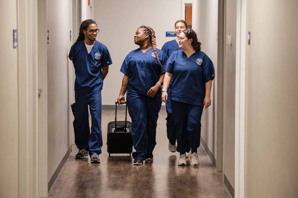 Massage students walking together down a hallway