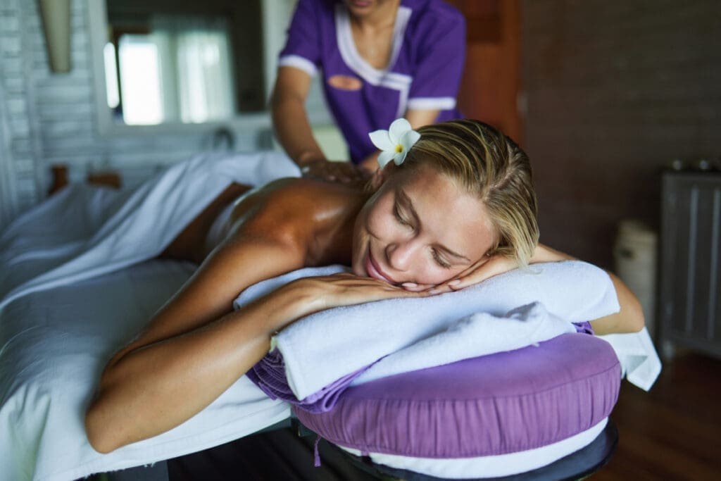 A woman getting a massage at a day spa
